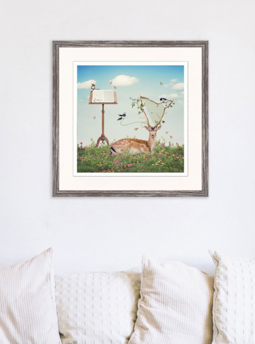 Pulling Strings in Barnwood frame on wall