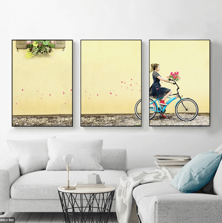 Girl on a bike triptych portrait displayed above a couch — Dana Klein fine art family photography, Park City Utah